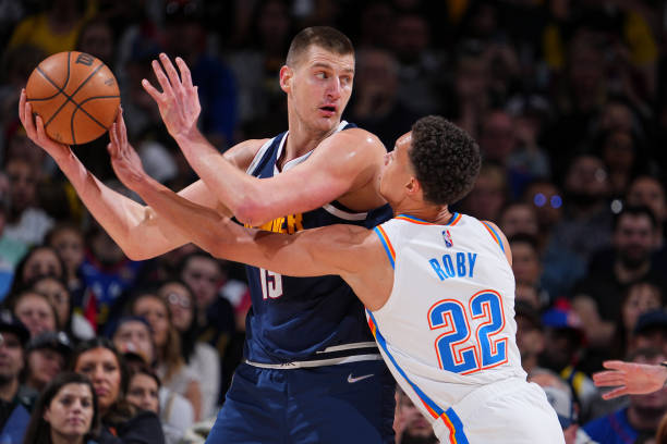 Nikola Jokic of the Denver Nuggets handles the ball during the game against the Oklahoma City Thunder on March 26, 2022 at the Ball Arena in Denver,...