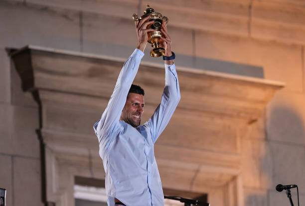 Novak Djokovic celebrates with the Wimbledon trophy during the welcoming ceremony in front of Belgrade City Hall on July 11, 2022 in Belgrade, Serbia.