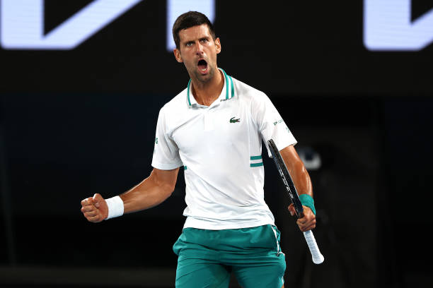 Novak Djokovic of Serbia celebrates after winning a set in his Men’s Singles Semifinals match against Aslan Karatsev of Russia during day 11 of the...