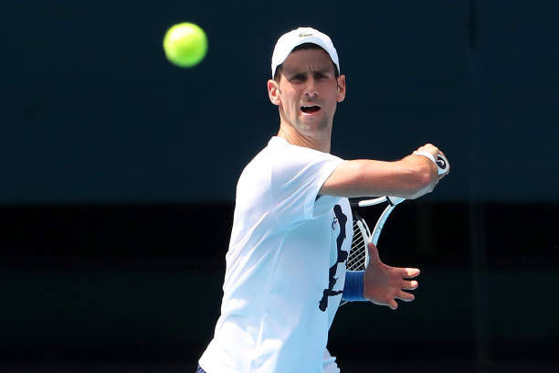 Novak Djokovic of Serbia practices on Rod Laver Arena ahead of the 2022 Australian Open at Melbourne Park on January 11, 2022 in Melbourne,...