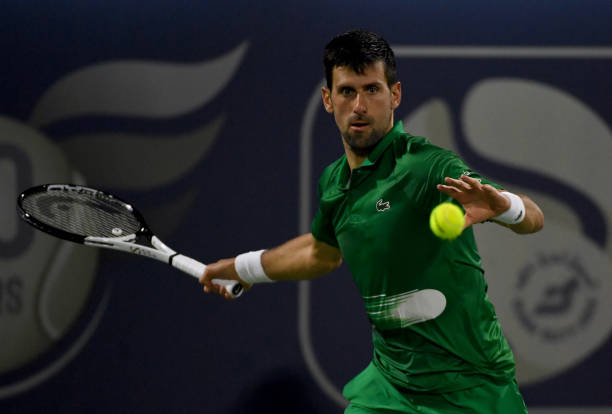 Novak Djokovic of Serbia returns the ball in the second round match against Karen Khachanov of Russia during day 10 of the Dubai Duty Free Tennis at...