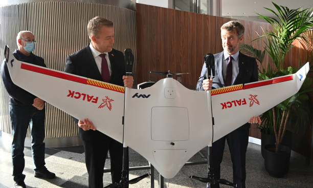 November 2021, Berlin: Crown Prince Frederik and Jakob Riis, CEO Falck, hold a drone during the tour after the Danish Trade Conference at the Kosmos...