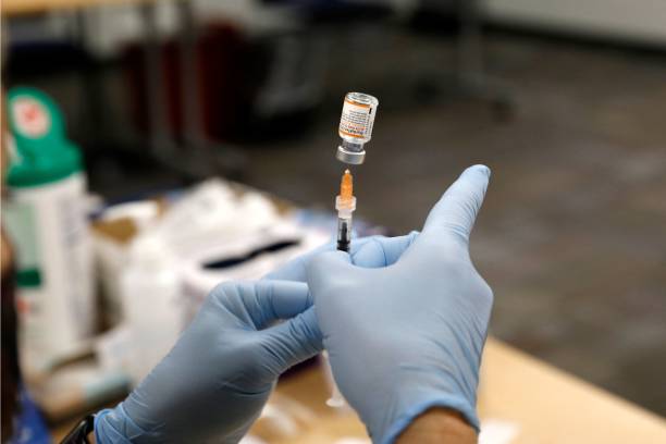 Nurse practitioner Sarah Rauner fills a syringe with the Pfizer Covid-19 vaccine to be administered to children from 5-11 years old are seen at the...