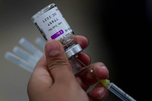 Nurse prepares a dose of the AstraZeneca vaccine against COVID-19 during the first day of the application of the third dose to people over 60...