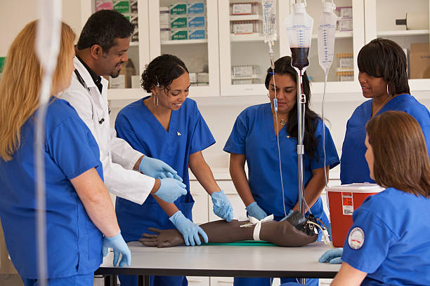 nurses learning to insert an iv drip in hospital picture