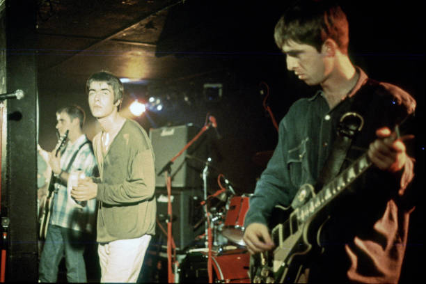 Oasis playing on stage in Hamburg in 1994