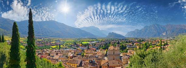 Old idyllic town surrounded by mountains with the Collegiata dell&#039;Assunta church and fascinating sky, Castello di Arco, Arco, Valle de Sarco, Lake Garda North, Trento, Trentino-Alto Adige, Italy