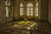 Old wood chair in an abandoned and dilapidated house