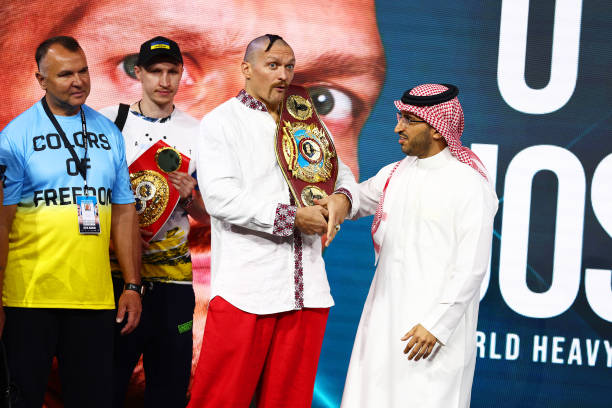 Oleksandr Usyk is presented with the new WBO Heavyweight Super World Title belt by Prince Fahad Bin Abdulaziz Al Saud during the Weigh-In for...