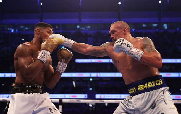 Oleksandr Usyk punches as Anthony Joshua ducks during the Heavyweight Title Fight between Anthony Joshua and Oleksandr Usyk at Tottenham Hotspur...