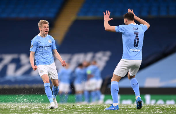 Oleksandr Zinchenko of Manchester City celebrates his side's first goal which came from a Riyad Mahrez goal with Ruben Dias during the UEFA Champions...