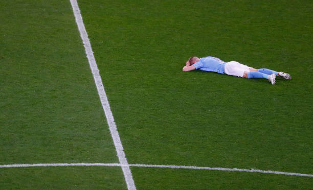 Oleksandr Zinchenko of Manchester City lies on the pitch dejected following defeat in the UEFA Champions League Final between Manchester City and...