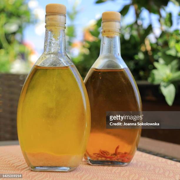 olive oil bottles wooden table background