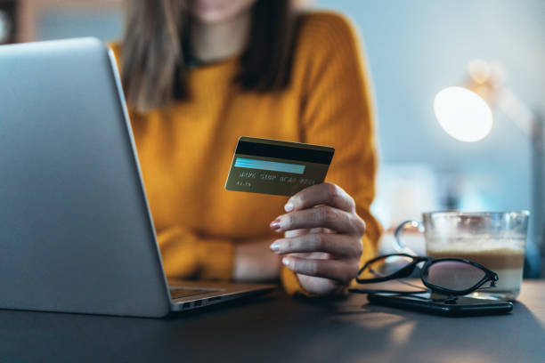 online payment - Getty Images online person doing transaction through credit cards on shopping sites