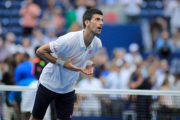 open-day-12-novak-djokovic-of-serbia-motions-to-give-his-heart-to-the-picture-id602178930