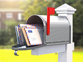 Open mailbox with letters on rural backgound.