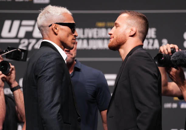 Opponents Charles Oliveira of Brazil and Justin Gaethje face off during the UFC 274 press conference at Arizona Federal Theatre on May 05, 2022 in...