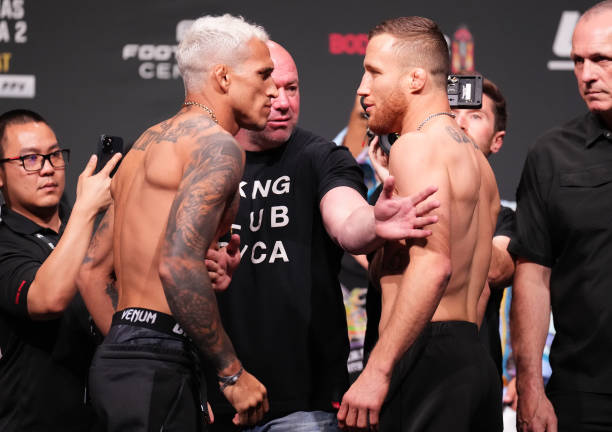 Opponents Charles Oliveira of Brazil and Justin Gaethje face off during the UFC 274 ceremonial weigh-in at the Arizona Federal Theatre on May 06,...
