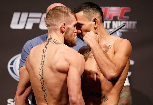 Opponents Conor McGregor and Max Holloway face off during the UFC weigh-in inside TD Garden on August 16, 2013 in Boston, Massachusetts.
