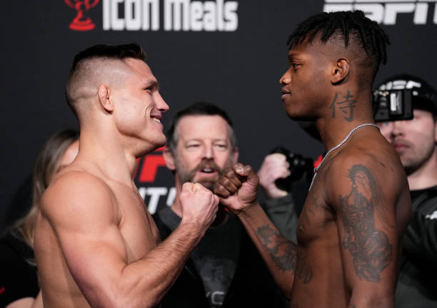 Opponents Drew Dober and Terrance McKinney \fo during the UFC Fight Night weigh-in at UFC APEX on March 11, 2022 in Las Vegas, Nevada.