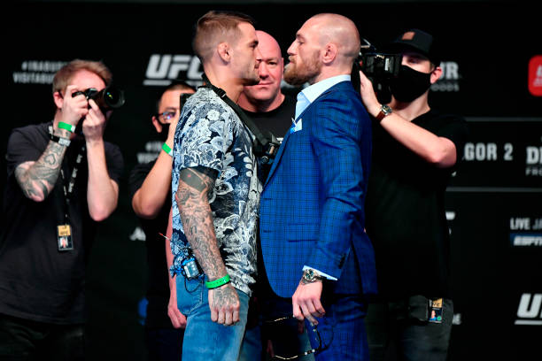 Opponents Dustin Poirier and Conor McGregor pose face off for media during the UFC 257 press conference event inside Etihad Arena on UFC Fight Island...