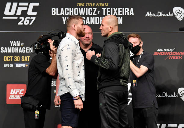 Opponents Jan Blachowicz of Poland and Glover Teixeira of Brazil face off during the UFC 267 press conference at Etihad Arena on October 28, 2021 in...