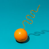image an orange with silly straw