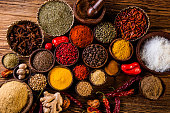 Oriental hot spices on wooden table