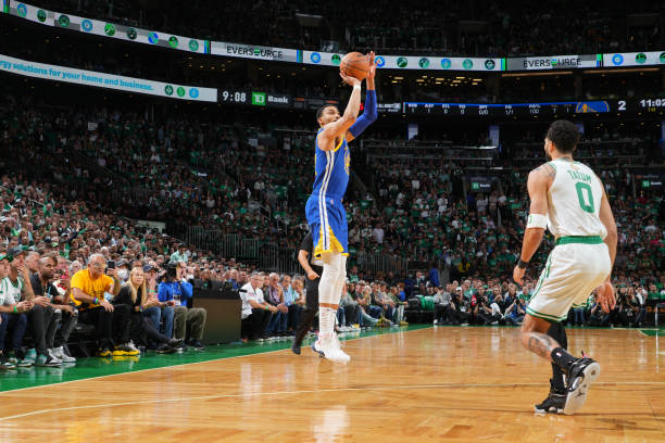 Otto Porter Jr. #32 of the Golden State Warriors shoots a three point basket against the Boston Celtics during Game Six of the 2022 NBA Finals on...