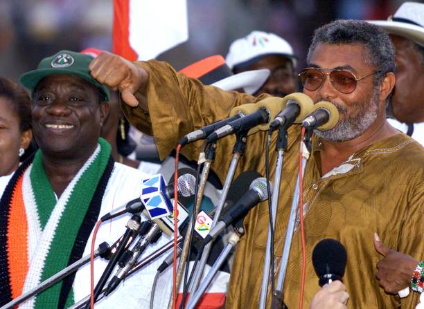 Outgoing Ghanean President Jerry Rawlings flanked by his chosen successor incumbent VicePresident John Mills addresses his supporters during an...