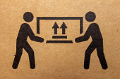 Packaging symbol to indicate heaviness and needs two people to lift