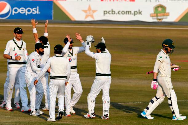 Pakistan's players celebrate after the dismissal of South Africa's Faf du Plessis during the second day of the second Test cricket match between...