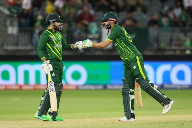 Pakistan's Shadab Khan and Shan Masood bump their fists during the ICC mens Twenty20 World Cup 2022 cricket match between Pakistan and Zimbabwe in...