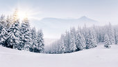 Panorama of the foggy winter mountains