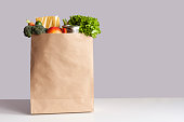 Paper bag with food gray background