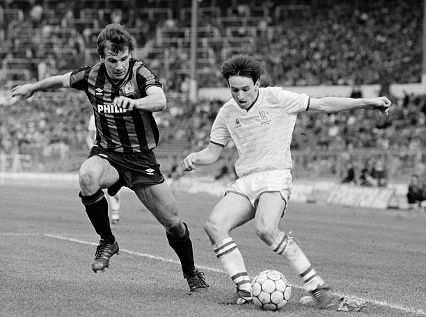 Pat Nevin of Chelsea is challenged by Manchester City defender Nicky Reid during the Full Members Cup Final at Wembley Stadium, 23rd March 1986....