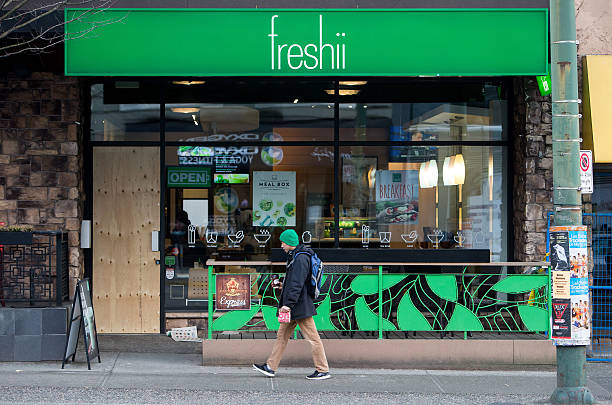 pedestrian walks past a freshii inc restaurant in vancouver british picture