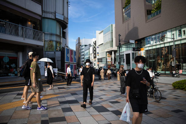 Pedestrians walk in Harajuku district, Tokyo, Japan