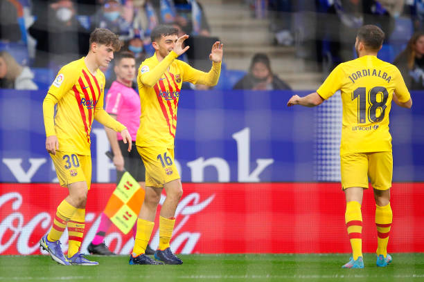 Pedro 'Pedri' of FC Barcelona celebrates scoring his teams first goal with team mates during the LaLiga Santander match between RCD Espanyol and FC...
