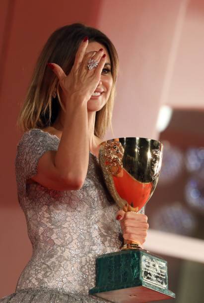 Penelope Cruz poses with the Coppa Volpi for Best Actress for Parallel Mothers during the awards winner photocall during the 78th Venice...