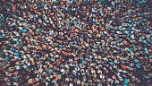 People crowd texture background. Bird eye view. Toned.