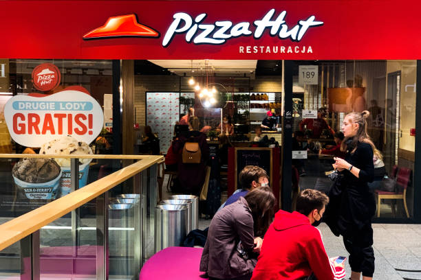 people in front of the pizzahut restaurant in krakow poland on august picture