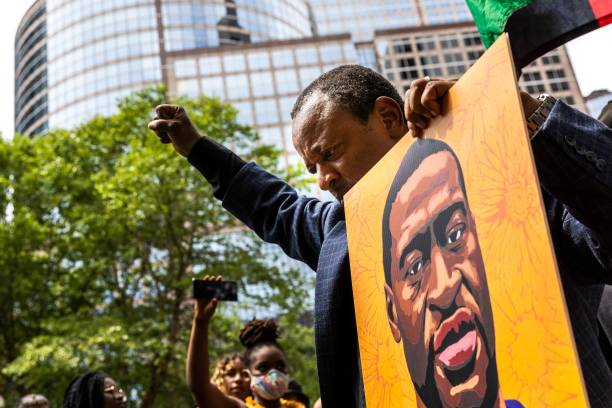 People react after learning the sentencing of former Minneapolis Police officer Derek Chauvin outside the Hennepin County Government Center on June...