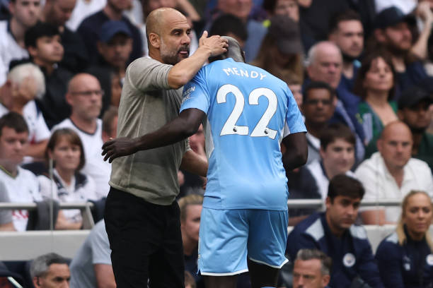 Pep Guardiola manager of Manchester City with Benjamin Mendy during the Premier League match between Tottenham Hotspur and Manchester City at...