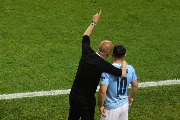 Pep Guardiola the manager / head coach of Manchester City gives instructions Sergio Aguero of Manchester City during the UEFA Champions League Final...