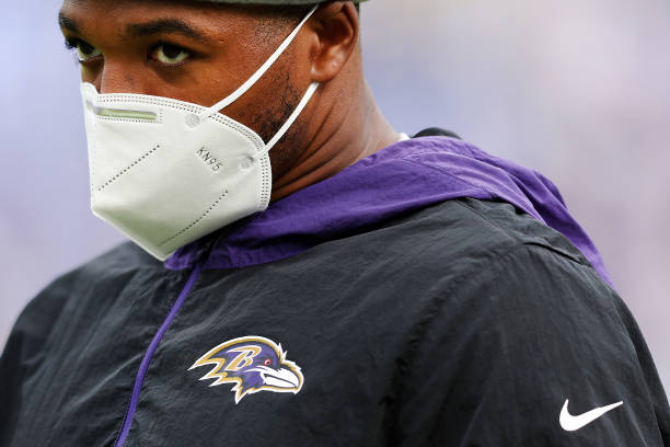 Person wears a KN-95 mask due to the Covid-19 pandemic before playing against the Los Angeles Chargers at M&T Bank Stadium on January 02, 2022 in...