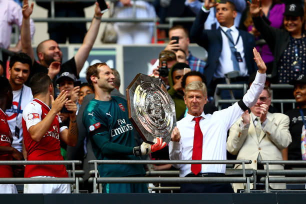 Petr Cech of Arsenal and Arsenal manager Arsene Wenger celebrate with the trophy following the The FA Community Shield final between Chelsea and...