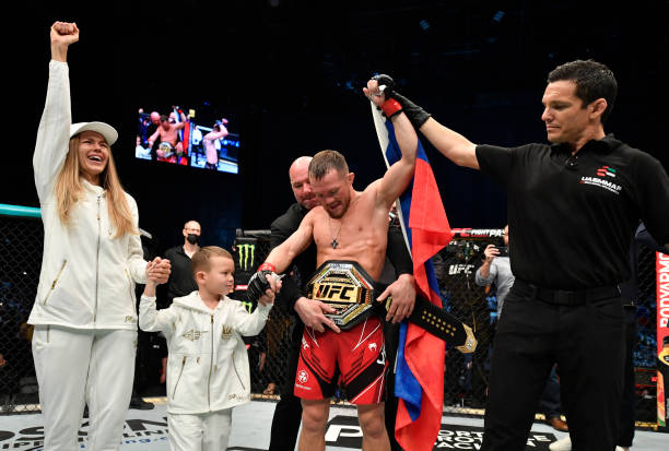 Petr Yan of Russia celebrates after his victory over Cory Sandhagen in the UFC interim bantamweight championship fight during the UFC 267 event at...