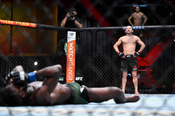 Petr Yan of Russia looks on after delivering an illegal knee against Aljamain Sterling in their UFC bantamweight championship fight during the UFC...