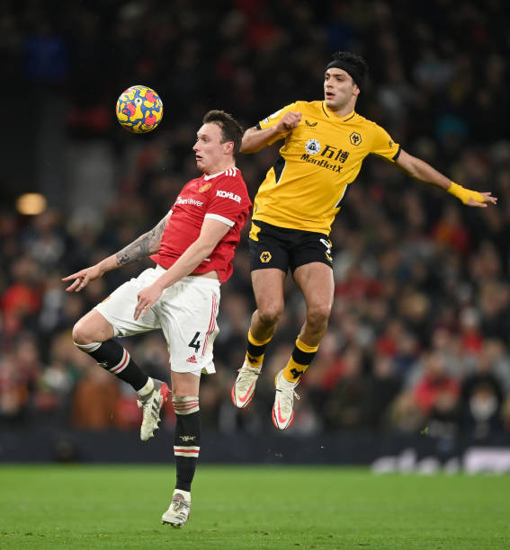 Phil Jones of Manchester United and Raul Jimenez of Wolverhampton Wanderers battle for possession during the Premier League match between Manchester...